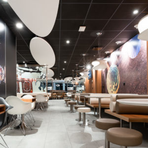 McDonald’s Arlanda Sky City

ROL Fredbergs would like to proudly present one of our latest projects that we have undertaken for McDonalds restaurants. McDonald's in Sky City within Arlanda airport, has opened a new system where the food is cooked to order and guests are then served at the tables. “With our new ordering and cooking system and table service, we offer our guests an even better restaurant experience”, says restaurant owner Roland Edin. The new system is expected to reduce food waste by 20 percent. “This concept looks very nice”, says ROL Fredbergs project manager Anders Gillström. We asked some of the customers their opinion on the restaurant and they agreed with Anders. “This is a calm place to sit down to rest and refill with new energy”, says Kim, one of the early morning customers.
ROL Fredbergs was given the go ahead to undertake the Project management services for a new construction of a McDonald's restaurant at Sky City. It is a very comprehensive project and its implementation took 9 weeks. Then followed 3 weeks of work on dismantling and restoring the room where McDonald's had the previous restaurant at the airport. The project included elements such as floating flooring, laying tiles, building walls, electrical work, painting, installing furnishings, installing alarms, coordinating kitchen construction and installing payment equipment and more.
“What was a bit special and challenging about this project was that there are two very sensitive tenants who are neighbours to the restaurant we built, a hotel and a bank. This meant that jobs that sound a lot like drilling or sawing could only be performed during specially agreed times of the day”, says Anders Gillström. We also had to make certain adjustments during the project because the conceptual drawing did not always match the fire protection equipment of the premises. But we made these adjustments in discussion with Per Widmark of McDonalds, during the project, says Anders. Thanks to a good dialogue, this did not create any problems.
We would like to take the opportunity to thank Per for good cooperation and positive dialogue during the project. The restaurant has become a very nice dining environment and the new layout for both the kitchen and the staff room is working well. “A tremendous improvement over the old restaurant”, says our Project Manager Anders. The new concept that has been built at Arlanda is called "Airport" to signify that it is used only at airports. https://rolfredbergs.com/