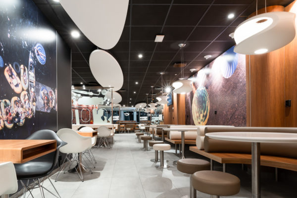 McDonald’s Arlanda Sky City

ROL Fredbergs would like to proudly present one of our latest projects that we have undertaken for McDonalds restaurants. McDonald's in Sky City within Arlanda airport, has opened a new system where the food is cooked to order and guests are then served at the tables. “With our new ordering and cooking system and table service, we offer our guests an even better restaurant experience”, says restaurant owner Roland Edin. The new system is expected to reduce food waste by 20 percent. “This concept looks very nice”, says ROL Fredbergs project manager Anders Gillström. We asked some of the customers their opinion on the restaurant and they agreed with Anders. “This is a calm place to sit down to rest and refill with new energy”, says Kim, one of the early morning customers.
ROL Fredbergs was given the go ahead to undertake the Project management services for a new construction of a McDonald's restaurant at Sky City. It is a very comprehensive project and its implementation took 9 weeks. Then followed 3 weeks of work on dismantling and restoring the room where McDonald's had the previous restaurant at the airport. The project included elements such as floating flooring, laying tiles, building walls, electrical work, painting, installing furnishings, installing alarms, coordinating kitchen construction and installing payment equipment and more.
“What was a bit special and challenging about this project was that there are two very sensitive tenants who are neighbours to the restaurant we built, a hotel and a bank. This meant that jobs that sound a lot like drilling or sawing could only be performed during specially agreed times of the day”, says Anders Gillström. We also had to make certain adjustments during the project because the conceptual drawing did not always match the fire protection equipment of the premises. But we made these adjustments in discussion with Per Widmark of McDonalds, during the project, says Anders. Thanks to a good dialogue, this did not create any problems.
We would like to take the opportunity to thank Per for good cooperation and positive dialogue during the project. The restaurant has become a very nice dining environment and the new layout for both the kitchen and the staff room is working well. “A tremendous improvement over the old restaurant”, says our Project Manager Anders. The new concept that has been built at Arlanda is called "Airport" to signify that it is used only at airports. https://rolfredbergs.com/