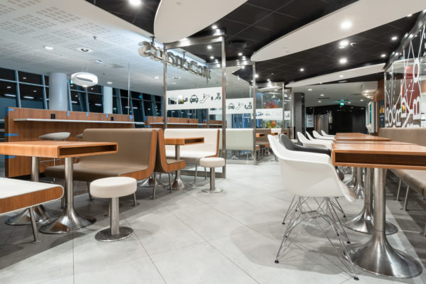 McDonald’s Arlanda Sky City

ROL Fredbergs would like to proudly present one of our latest projects that we have undertaken for McDonalds restaurants. McDonald's in Sky City within Arlanda airport, has opened a new system where the food is cooked to order and guests are then served at the tables. “With our new ordering and cooking system and table service, we offer our guests an even better restaurant experience”, says restaurant owner Roland Edin. The new system is expected to reduce food waste by 20 percent. “This concept looks very nice”, says ROL Fredbergs project manager Anders Gillström. We asked some of the customers their opinion on the restaurant and they agreed with Anders. “This is a calm place to sit down to rest and refill with new energy”, says Kim, one of the early morning customers.
ROL Fredbergs was given the go ahead to undertake the Project management services for a new construction of a McDonald's restaurant at Sky City. It is a very comprehensive project and its implementation took 9 weeks. Then followed 3 weeks of work on dismantling and restoring the room where McDonald's had the previous restaurant at the airport. The project included elements such as floating flooring, laying tiles, building walls, electrical work, painting, installing furnishings, installing alarms, coordinating kitchen construction and installing payment equipment and more.
“What was a bit special and challenging about this project was that there are two very sensitive tenants who are neighbours to the restaurant we built, a hotel and a bank. This meant that jobs that sound a lot like drilling or sawing could only be performed during specially agreed times of the day”, says Anders Gillström. We also had to make certain adjustments during the project because the conceptual drawing did not always match the fire protection equipment of the premises. But we made these adjustments in discussion with Per Widmark of McDonalds, during the project, says Anders. Thanks to a good dialogue, this did not create any problems.
We would like to take the opportunity to thank Per for good cooperation and positive dialogue during the project. The restaurant has become a very nice dining environment and the new layout for both the kitchen and the staff room is working well. “A tremendous improvement over the old restaurant”, says our Project Manager Anders. The new concept that has been built at Arlanda is called "Airport" to signify that it is used only at airports. https://rolfredbergs.com/