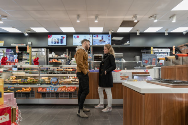 OKQ8 - Quick To Go
We are revisiting the forecourt store OKQ8 that is next to Landvetter airport in Gothenburg, where the new concept rollout called “Quick To Go” started in 2014. “Since this first store delivery, ROL Fredbergs have completed about 240 store deliveries to OKQ8 – updating their stores to the Quick To Go concept” – says Maria Sandberg, Project manager at ROL Fredbergs.
“I´m happy to find the store in such a good shape, after six years in use, it still looks very fresh”, says Maria. During the intervening years OKQ8 and ROL Fredbergs have developed many updates and additions to the Quick to Go concept. 
We had the chance to talk to Tobias Lindmark, Store concept & Brand experience developer for OKQ8, and asked him about our co-operation. He commented that, “ROL Fredbergs is an important part of our development work. ROL Fredbergs adds a high level of expertise and the knowledge we seek in a partner rather than a supplier. With its broad knowledge, ROL Fredbergs adds both business understanding and customer benefit within our forecourt store network”.
What do you think is important in order to give the customer a positive experience in your store? “With OKQ8's wide product range, it is important to always put the customer satisfaction first and always offer the best possible service, whether we talk about food, convenience, car hire, car wash or motorist products. Our customer service expertise guarantees the very best retail experience at our stations
Tobias also said – “We are constantly making improvements and updates. Credibility, customer satisfaction and sustainability are always on top of our mind. No concept is better than its followers, we are very proud to be able to present a complete retail chain with the same concept across all its stations in the near future. It proves the greatness of the brand OKQ8.”

Maria explains how the retail concept update process often looks like. “The retail concept process normally starts with an idea from OKQ8, it can be a verbal description or sometimes a hand sketch. Then the ROL Fredbergs design team normally makes 3D visualization as the next step. Often there will be some minor adjustments from the initial interpretation. The following step is for ROL Fredbergs technical designers to make a design drawing. Often OKQ8 would like to see the solution prior to delivery, we then involve our prototyping department. With skilled and experienced factory workers, we can quickly produce the shop fixtures. In-house we can work with metal, wood, acrylic, composite materials, plus we have a partner network if we need other materials or solutions for the prototype. When the prototype is being validated there might be some new ideas or smaller updates. Then, when OKQ8 are happy with the result, we are all set for a large rollout of the new designed shopfitting concept solution.” 
A fresh example of concept updates is the new developed “Energizon” which is being rolled out. 
Maria has 18 years’ experience working with concept development and project management at ROL Fredbergs.  Maria feels that the key to achieving client satisfaction includes a few factors to secure a successful concept rollout. “Communication is always key. So many things can happen and an open communication with an honest dialogue is always the best. Then we need an understanding of what OKQ8 needs and the ability to convert the ideas into solutions. Often the timeline is short and there is a need for quick decision making, otherwise there is always a risk to jeopardize the project time plan.” 

OKQ8 AB is one of Sweden's largest fuel companies. In 2012, OKQ8 AB in Sweden and Q8 Denmark A / S merged to form OKQ8 Scandinavia. The Swedish operations comprise about 740 stations. OKQ8 sells fuels such as gasoline, diesel, biogas, HVO100 and electric car charging. Many of OKQ8's 350 staffed service stations offer car wash, self-service laundry, car rental and garage, as well as car products and fast food.